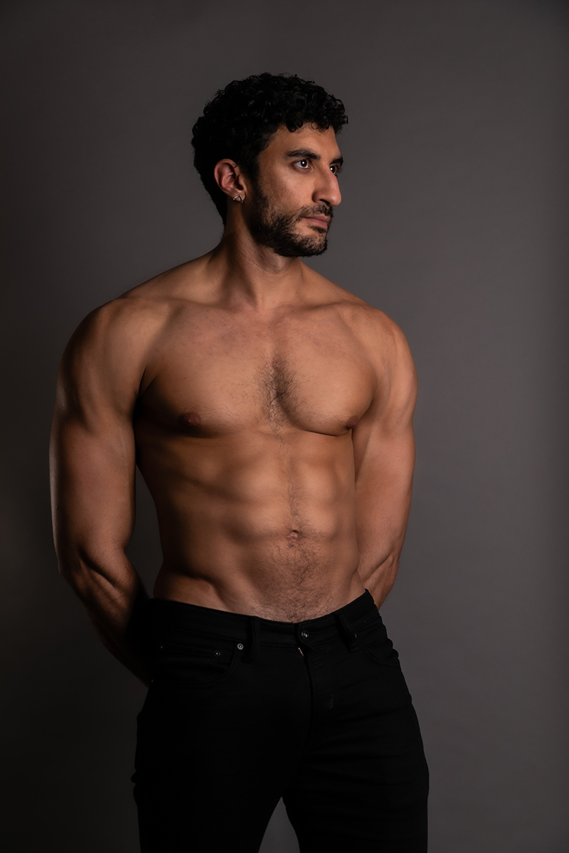 Two figures embracing in the shadows