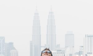 Man at Kuala Lumpur Skybar infinity pool with Petronas Towers, DNA #288