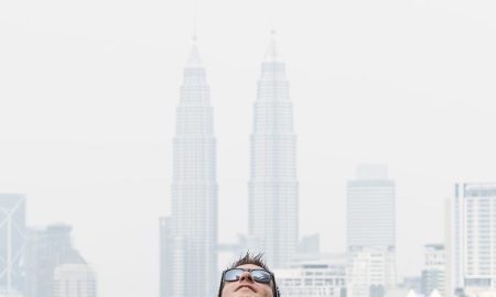 Man at Kuala Lumpur Skybar infinity pool with Petronas Towers, DNA #288