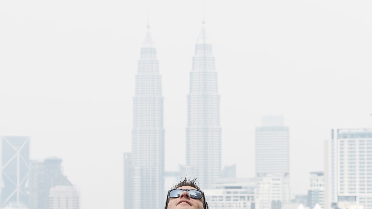 Man at Kuala Lumpur Skybar infinity pool with Petronas Towers, DNA #288