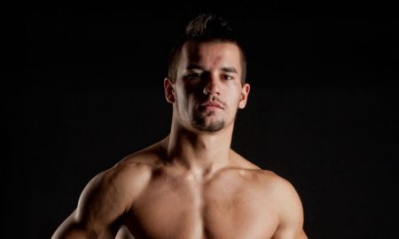 A fit man posing - illustrating health and body wellness for DNA Magazine
