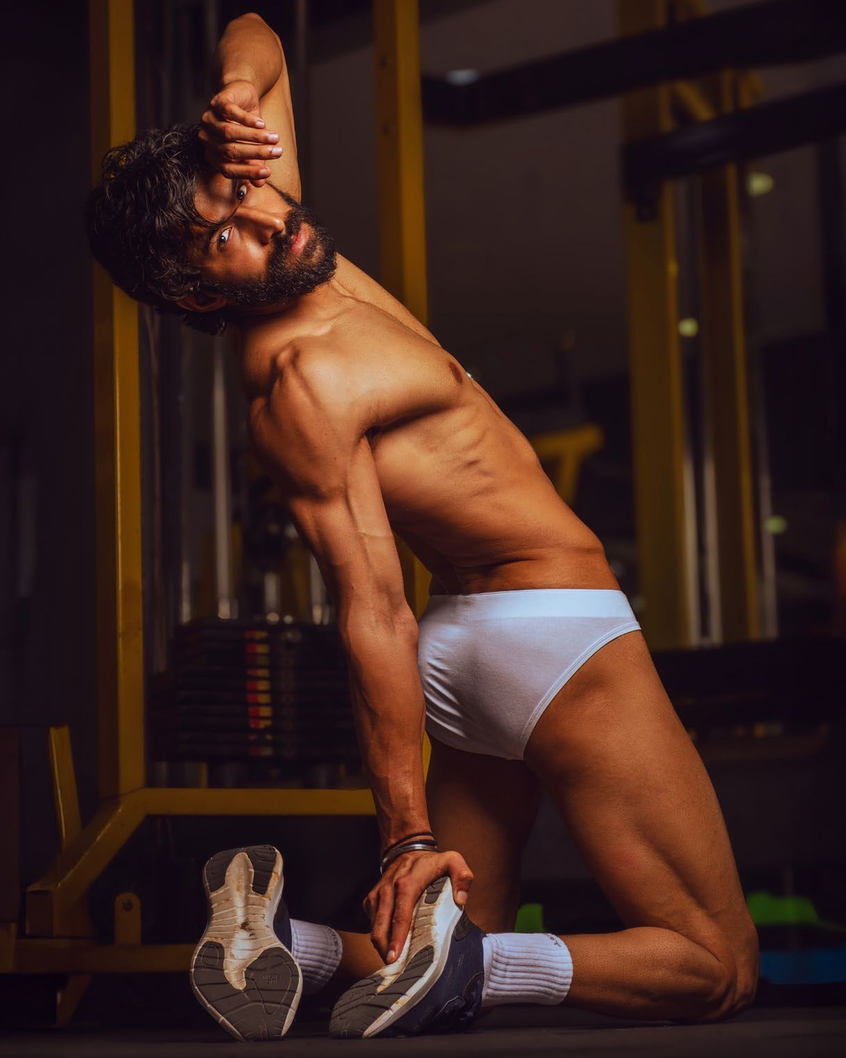 Arvind Baldiya stretching in the gym