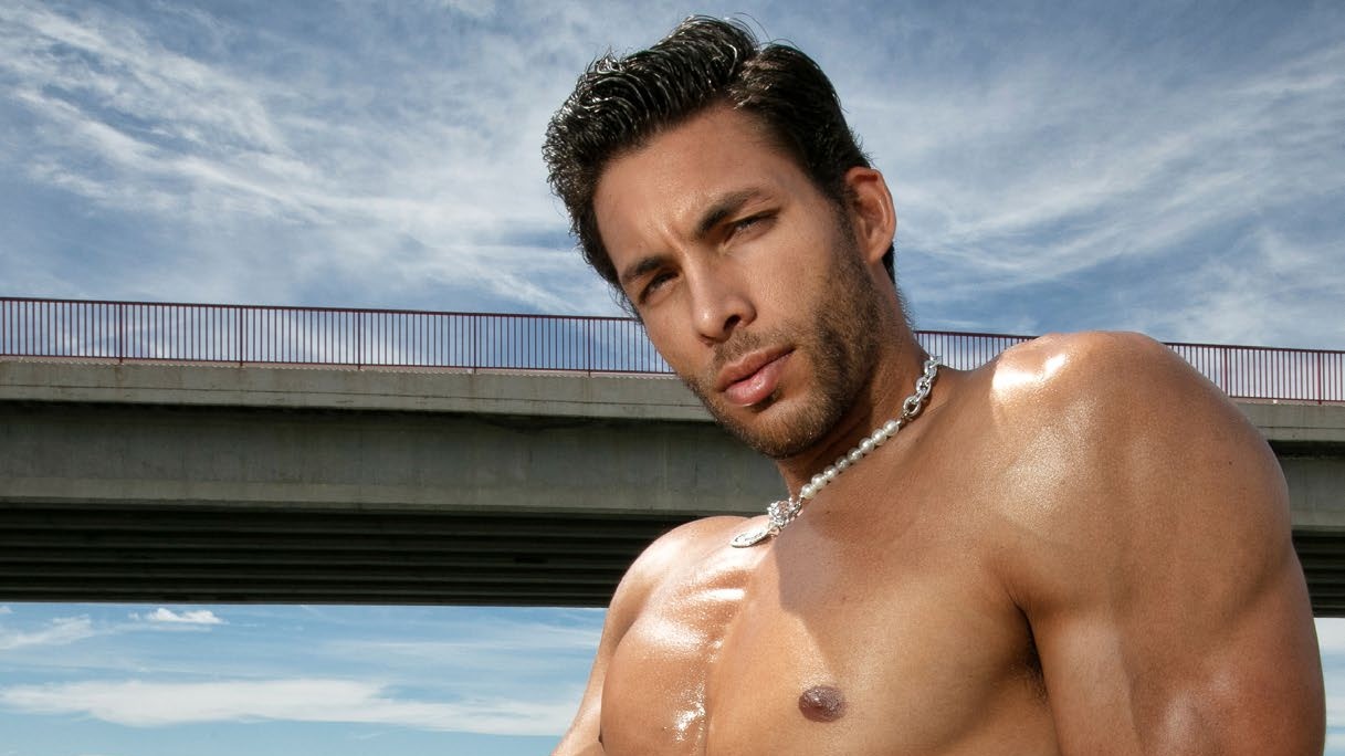 Model in Code 22 turquoise jockstrap by a lake, DNA Big In Underwear 2023 feature