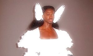 Lil Nas X wearing angel wings and holding rifles for his single J Christ