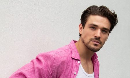 Matthew Hearne, actor and Paralympic athlete, wearing a pink linen shirt