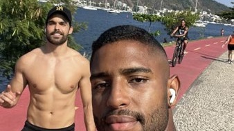 João Lucas Reis da Silva jogging with a training partner along Rio de Janeiro's waterfront
